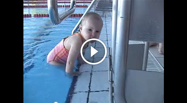 Cute little baby girl swimming
