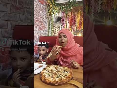 Enjoying Pizza #travel #bangladesh #pizza #food #funny #family