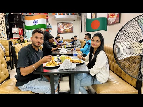 Indian boy having lunch with Bangladeshi girl