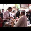 France's Macron samples local food in Bangladesh, takes boat trip | AFP