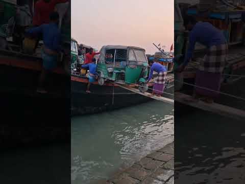 tuk tuk offloading from a boat in Chattogram